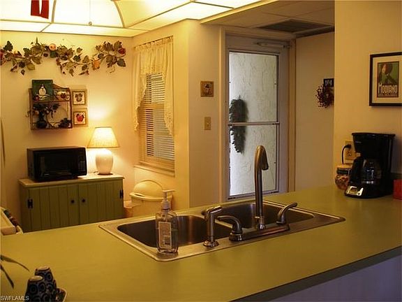 The entry features a storm door with screens which allows breezes to flow throughout the foyer and great room.