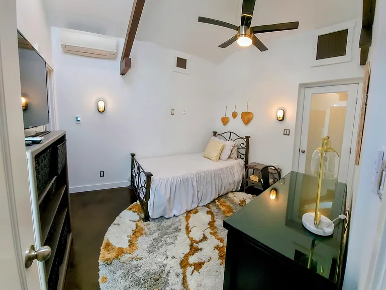2nd bedroom with desk and twin bed