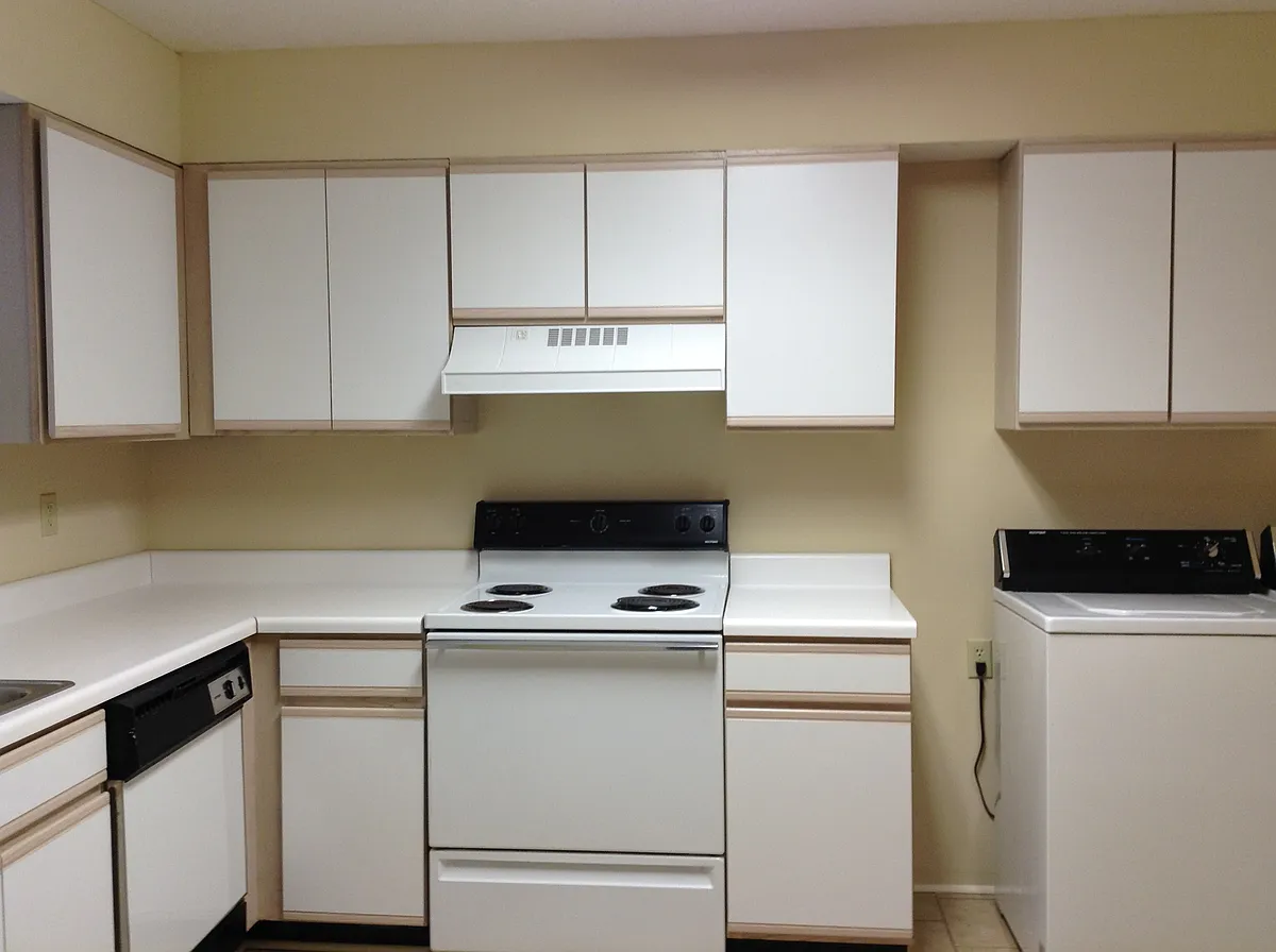 Kitchen around corner from first pic, showing stove. Note lots of cabinets in these two pics - 107 S 17th St #C-I