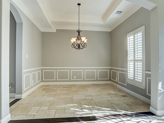 Archway into the formal dining is just the beginning of all the character throughout the home.