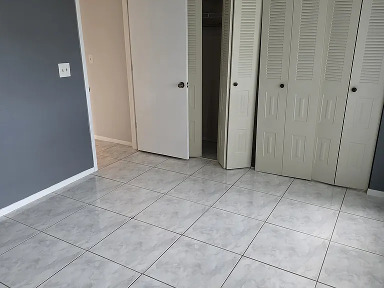 bedroom 2 from corner showing closet and door to enter