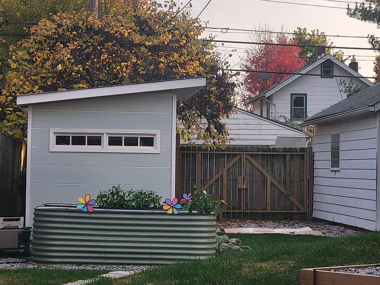 owner shed with raised beds