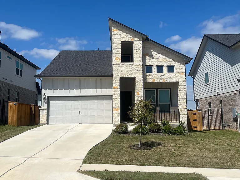 Spacious front yard, beautiful oak tree, and inviting front porch. This is perfect for relaxing evenings.