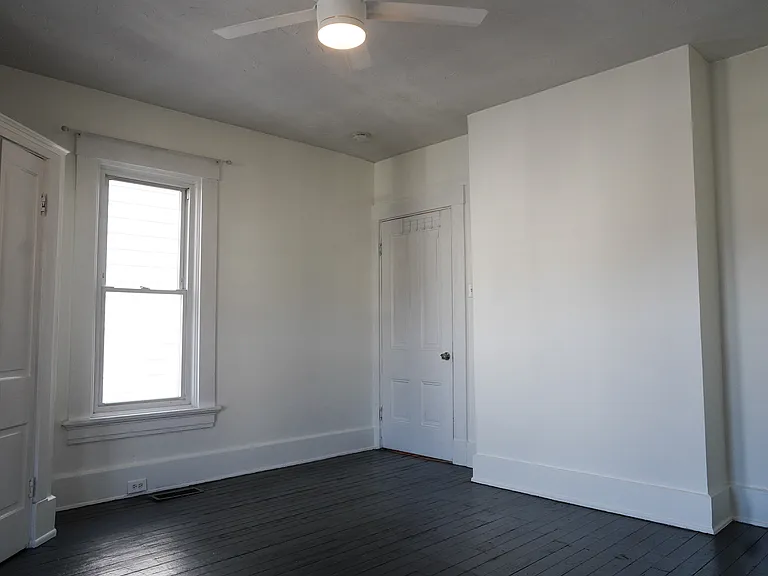 The larger bedroom offers a spacious closet and beautiful window light.