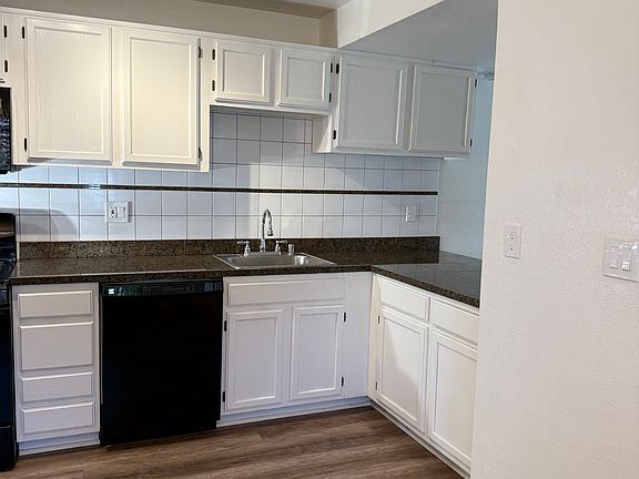 Kitchen - complete with granite countertops, oven, microwave, dishwasher and refrigerator.