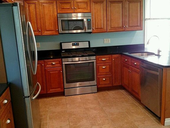Remodeled kitchen. Microwave, dishwasher, gas stove with open concept view to living room. Washer and Dryer located off kitchen.