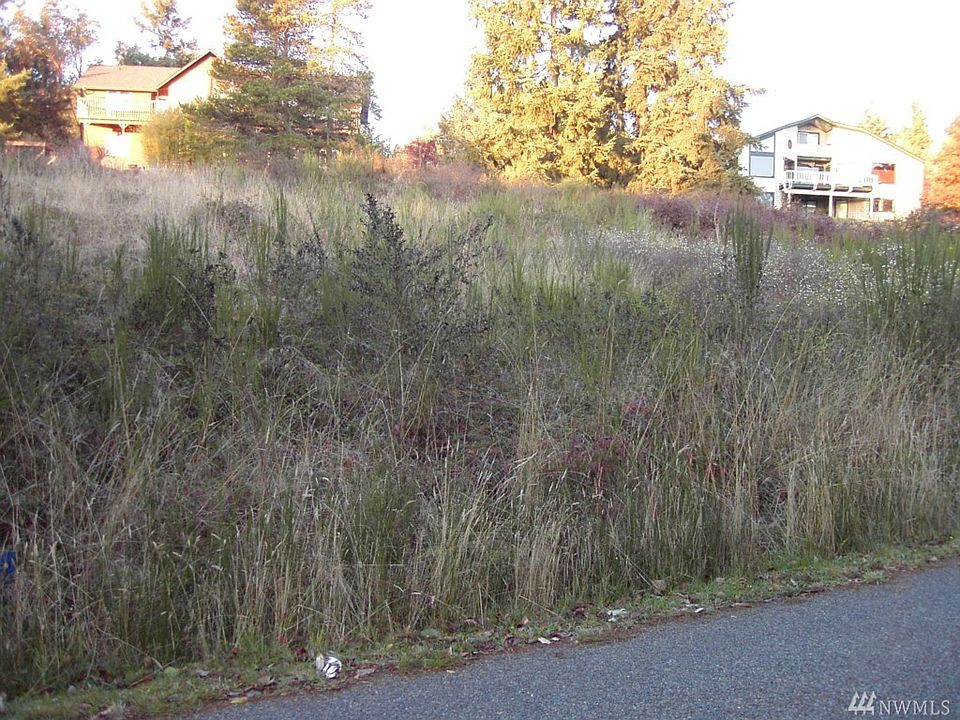 Gently sloping double lot in an area of beautiful homes and a block away from views of the Olympics Mountains, Discovery Bay and stunning sunsets.  View taken from west side of property.