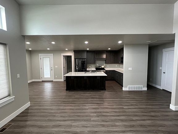 kitchen with granite countertops covered deck, fenced yard