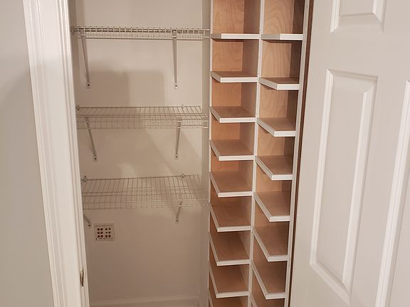 Closet (at top of stairs across from the front door)