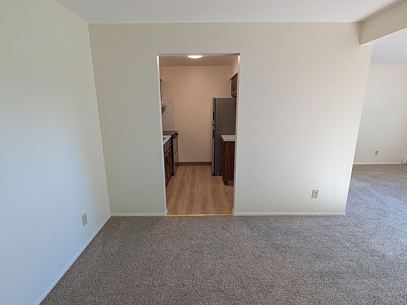 Open concept living and dining with fresh paint and new flooring