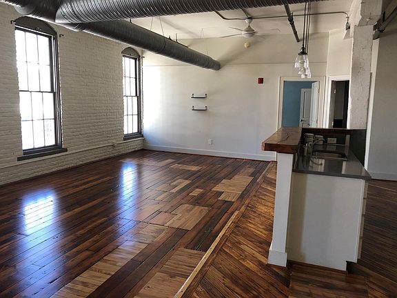 View of living/kitchen looking toward bedroom and bath.