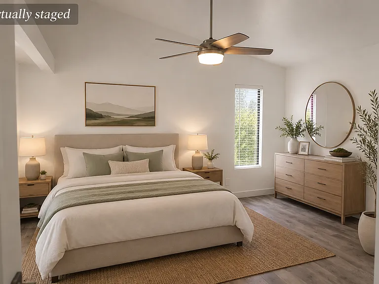 Primary bedroom with his and hers closets. Virtually staged