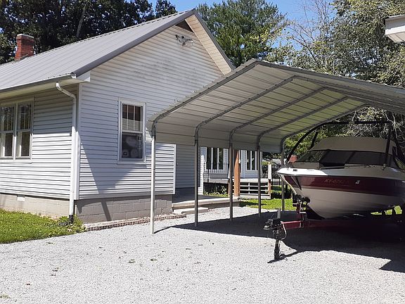 Kitchen porch and car port from driveway