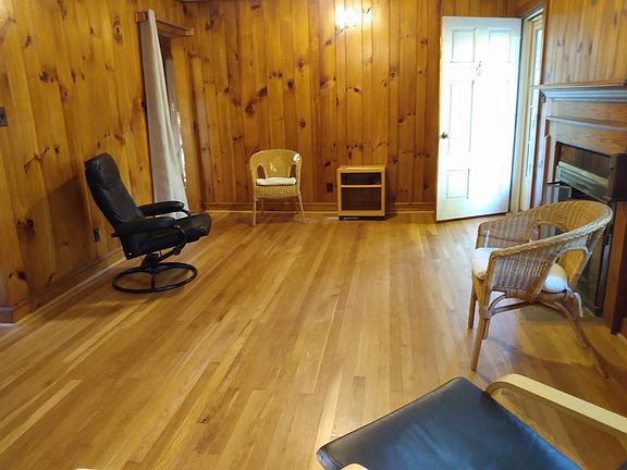 floral carpet and other pieces added since this photo of living room