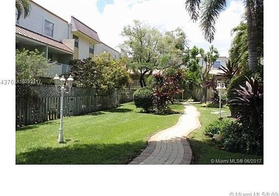 Walkway thru the Complex with Lush Landscaping