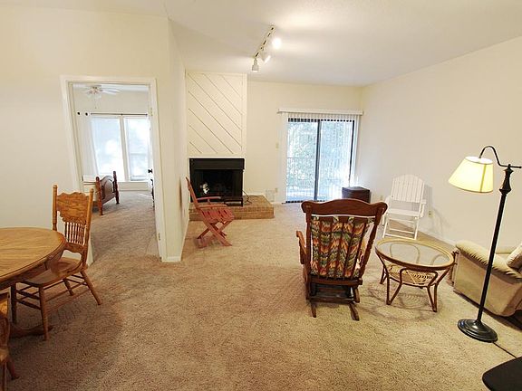 Living area at the right side with a dining area on the left.