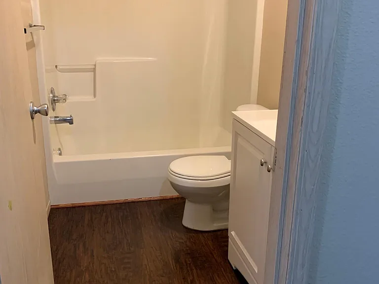 Downstairs full bath/shower. New vanity, sink and floors.