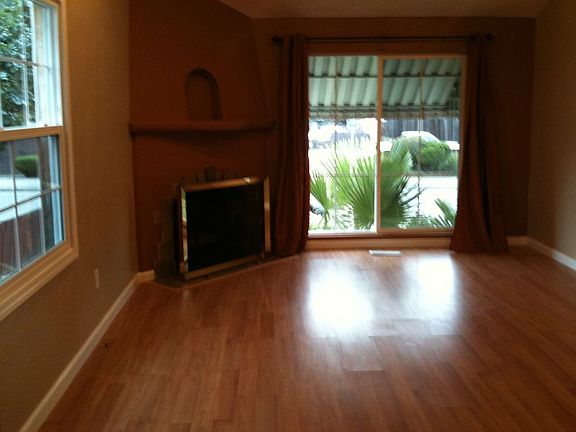 Living room and front window with working fireplace