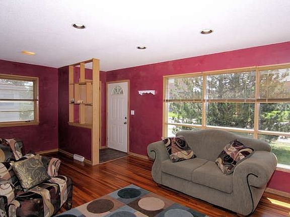 Living Room feature large windows.