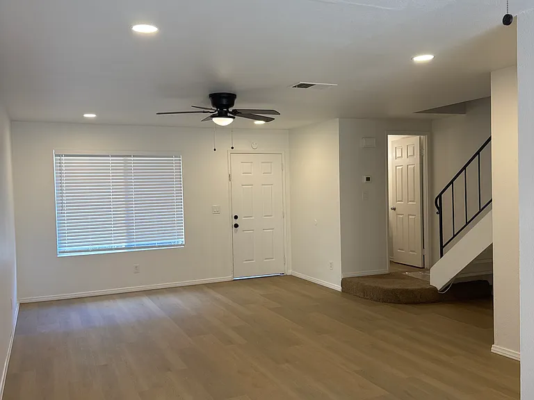 Living room with luxury 8 in vinyl plank flooring, LED lights on dimmers and new fans