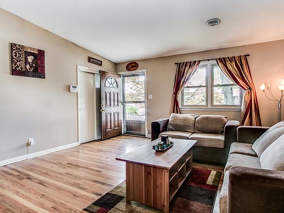 Living room entrance w/ coat closet