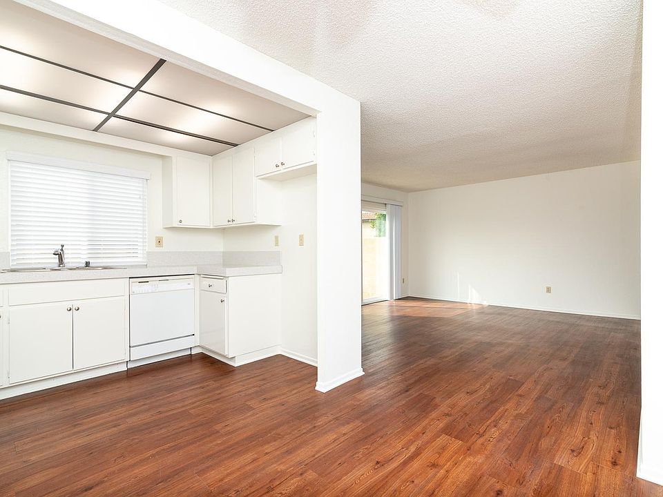 OPEN KITCHEN, DINING AND LIVING AREA OFF THE PATIO