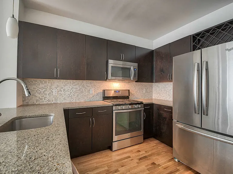 Every kitchen features modern granite counters and Mosaic tiled backsplashes