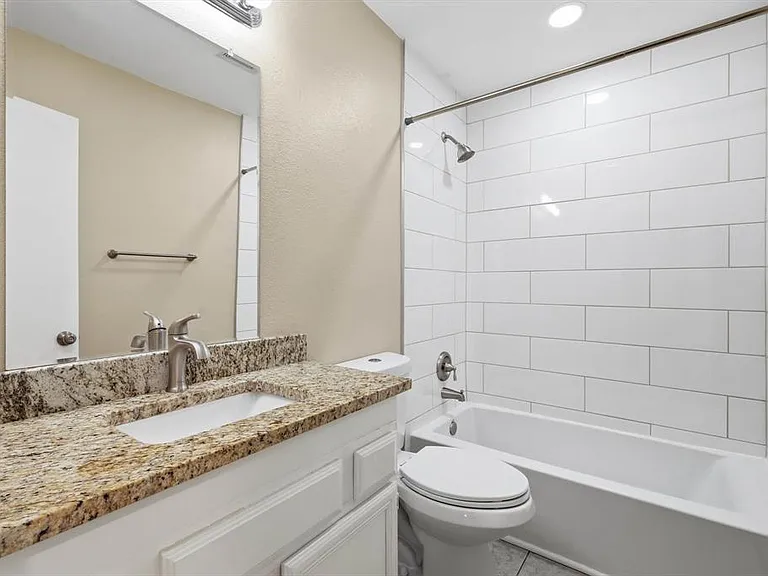 Full bath with vanity and bathtub / shower combination