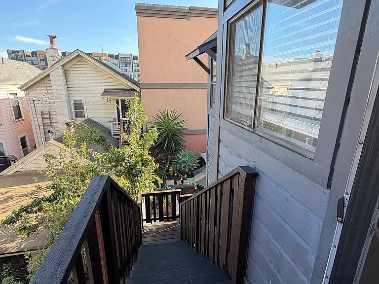 Staircase Leading to the Shared Backyard and Detached Garage.
