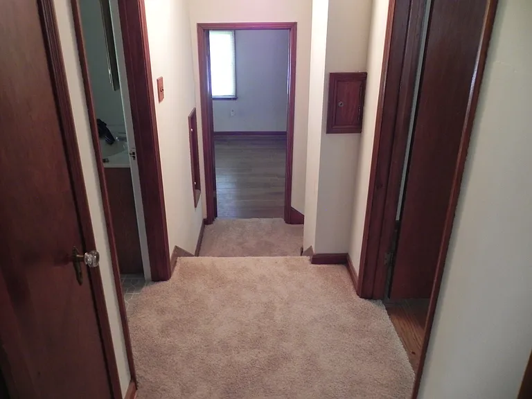 Upstairs hallway from 3rd bedroom-steps to landing at top of stairs, and landing into bedroom over garage.
