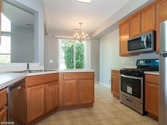 Kitchen with Brand New Steel Appliances, Sliding Patio Door, beautiful breakfast area