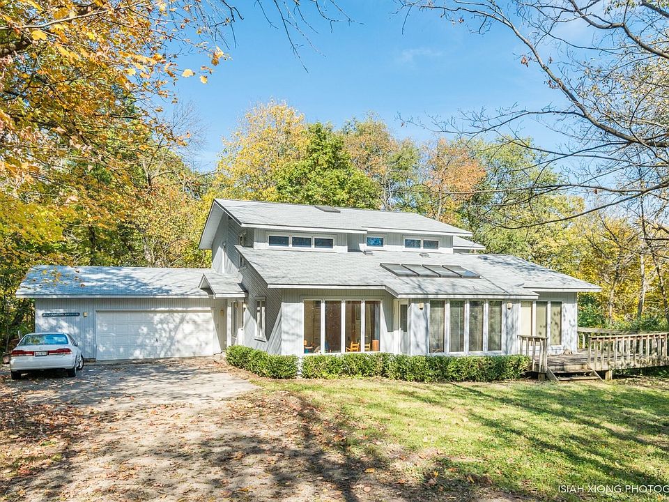 Nestled on a tree filled lot with the DuPage River running thru at the back.