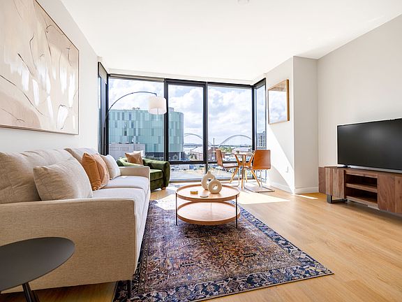 Floor-to-ceiling windows invite natural light into every corner