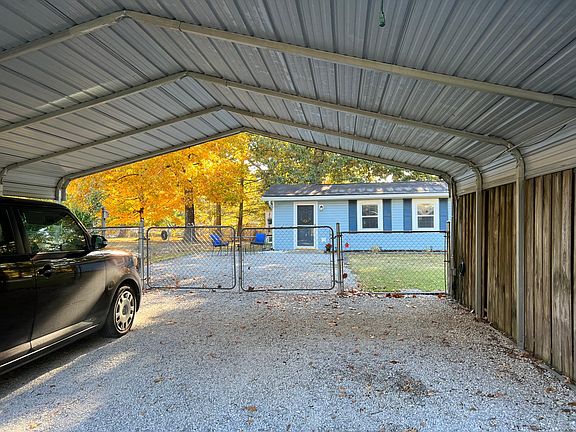 Two car carport. No more ice on your windows and it keeps your car cleaner and cooler in the summertime.