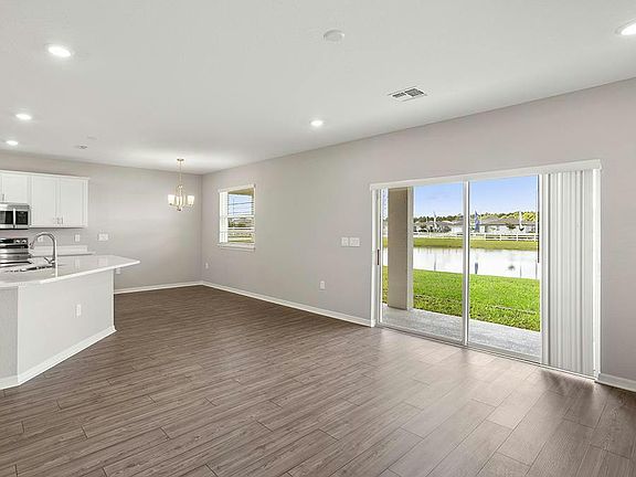 Your new home features a bright and welcoming open-concept living area - Seabrooke ll by Highland Ho