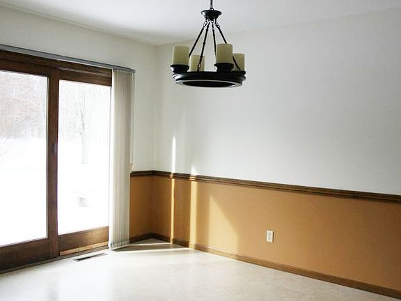 The newer sliding glass door opens onto a great deck.
