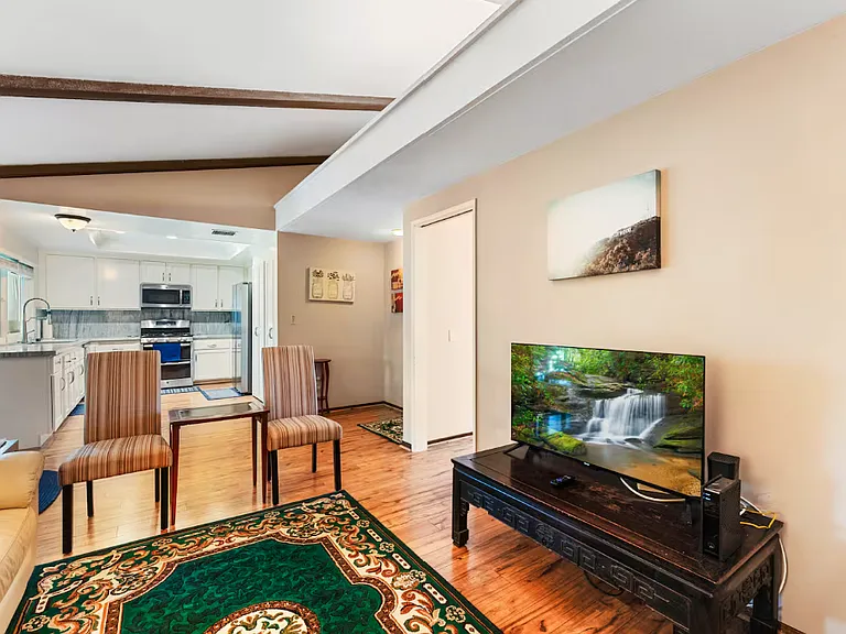 As can be seen in this picture, this family /tv room is adjacent to the kitchen