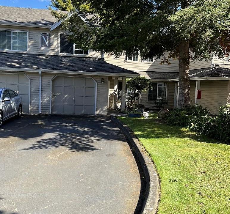 Unit has its own driveway for multiple cars.
