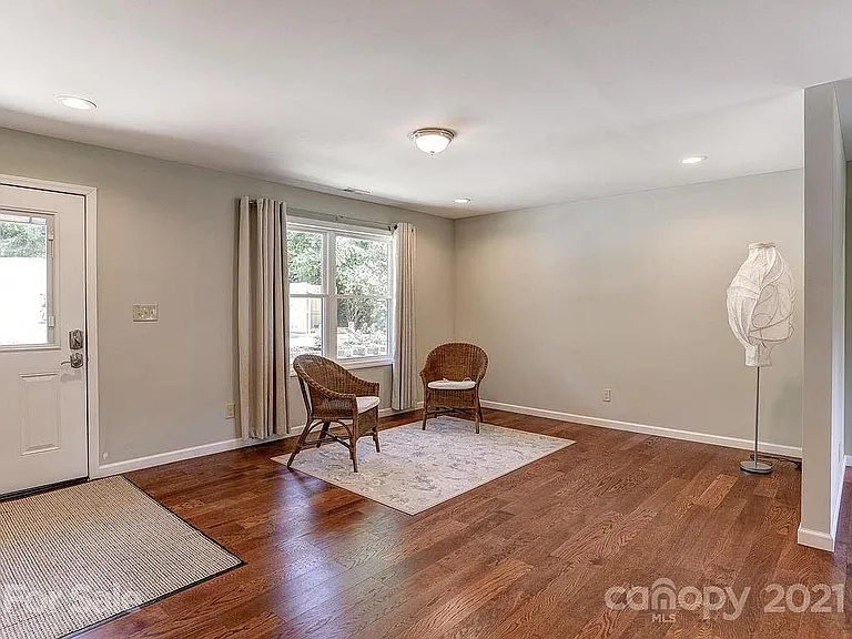 Sunny and bright living area. All the windows throughout the house create a lovely cross breeze on spring and fall days! Central heat and A/C keep you cozy otherwise.