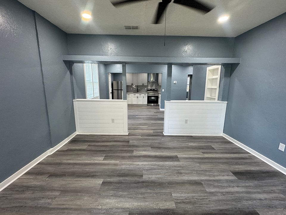 FAMILY ROOM, DINING ROOM & KITCHEN VIEW FROM FRONT DOOR ENTRANCE