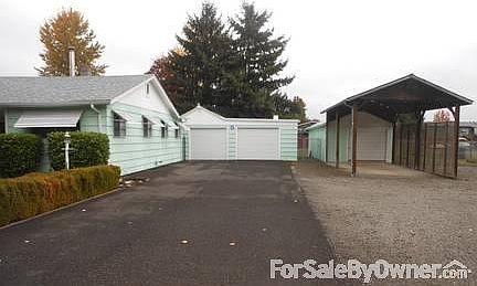 Long Asphalt Driveway
						:
						Oversized Garage and 16x20 RV Storage Garage