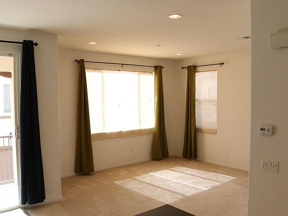 Living area plenty of light, window dressings optional