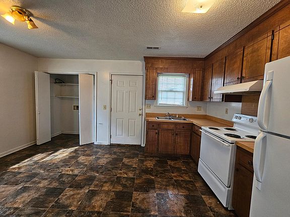 Kitchen, washer/dryer closet to the left