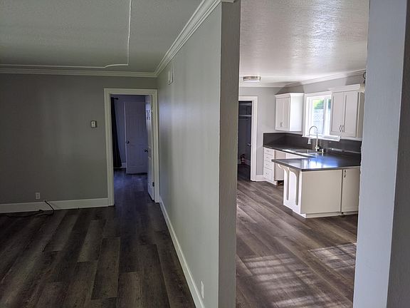 Living Room, Master Bedroom to the back, Entry to Dining Room/Kitchen on the right