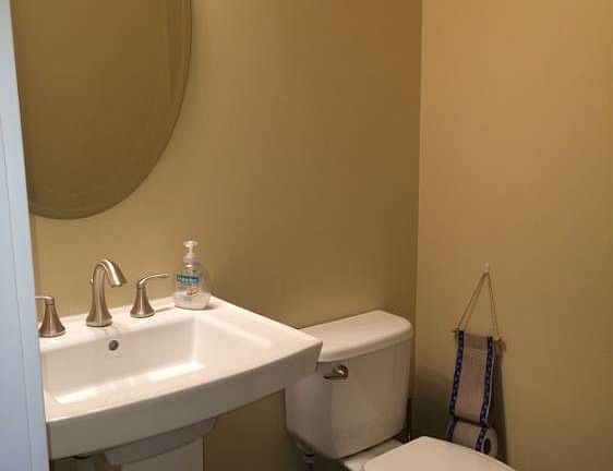 Powder room for guests and is easily accessible when coming in from the outdoors or garage.