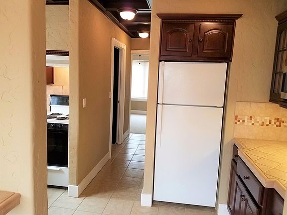 hallway leads to stairs, bedroom, pantry, and bathroom