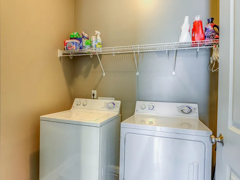 Laundry room with washer and drier.