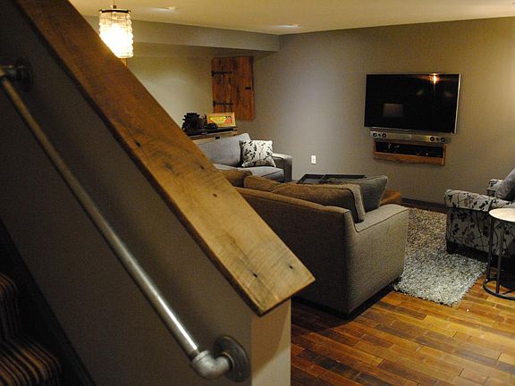 Beautiful Reclaimed Barnwood Finished Basement with Hardwood