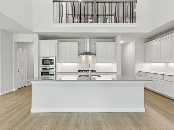 Kitchen in the Mercury home plan by Trophy Signature Homes - REPRESENTATIVE PHOTO