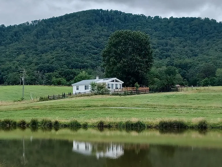 Lake cottage (June 2025) with Pigeon Top mountain in the background